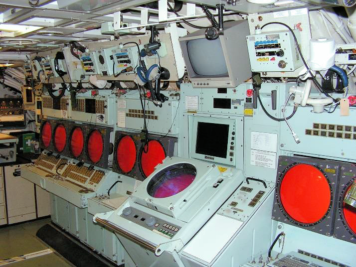 Either side of the PCO's console, standing out, are the TMA consoles. The two fire control consoles with their double screens are furthest away